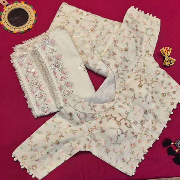 Elegant ivory lehenga choli set featuring delicate floral embroidery and mirror work